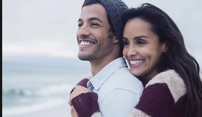 Couple hugging on the beach